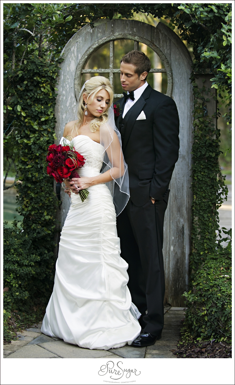 Beautiful Bride and Groom in red and black wedding at Palm Valley Gardens in Ponte Vedra